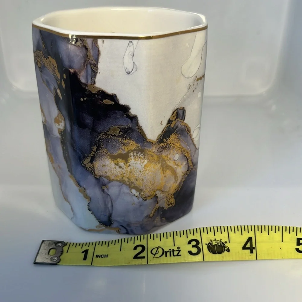 Ceramic cup, purple, gold, white.